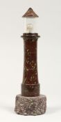 A CORNISH CARVED SERPENTINE LIGHTHOUSE FORM TABLE LAMP 11ins high.