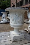 A VERY GOOD PAIR OF ITALIAN CARVED WHITE MARBLE TWO HANDLED URNS, the sides carved with figures