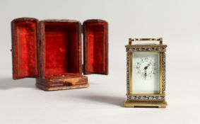 A SUPERB 19TH CENTURY FRENCH BRASS AND ENAMEL CARRIAGE CLOCK, the sides with brilliants, the face