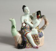 A SMALL CHINESE PORCELAIN EROTIC TEA POT 5.5ins high.
