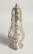 A LARGE VICTORIAN SILVER SUGAR CASTOR with repousse decorations London 1888