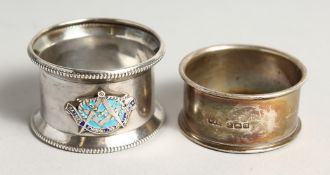 A SILVER AND ENAMEL MASONIC SERVIETTE RING ST JOHNS LODGE 1030 and a small plain serviette ring