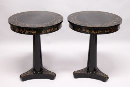 A PAIR OF BLACK LACQUER CIRCULAR PEDESTAL TABLES, 20th Century, the tops frieze and tricorn base