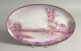 A PORCELAIN OVAL PLAQUE, painted with cattle and a man by a pond. Signed. 16.5 ins wide.