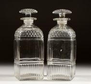 A PAIR OF CUT GLASS SQUARE SHAPED DECANTERS 7ins high