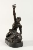A BRONZE NUDE MAN on a rock with arms raised. 14ins high