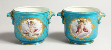 A GOOD PAIR OF SEVRES PORCELAIN CACHE POTS, blue ground painted with reverse panels of fruit. Mark