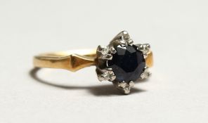 A WHITE GOLD DIAMOND AND SAPPHIRE RING