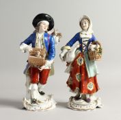A PAIR OF SAMSON CHELSEA DERRY PORCELAIN FIGURES, a man with a rabbit in a box, a girl carrying a