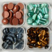 FOUR SMALL BOXES OF TIGER'S EYE STONES