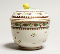 A VIENNA PORCELAIN BOWL AND COVER, apple finial. Beehive mark in puce, No. 24 4.5ins high.