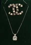 A CHANEL REPLICA BROOCH AND NECKLACE
