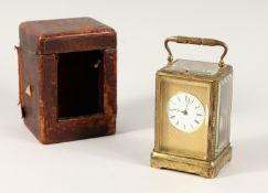 A GOOD 19TH CENTURY FRENCH BRASS REPEATER CARRIAGE CLOCK with engine turned face, black and white