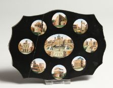 A SHAPED SLATE PANEL INSET WITH AN OVAL MICRO MOSAIC PANEL DEPICTING A CLASSICAL SCENE, surrounded