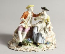 A GOOD FUSTENBURG PORCELAIN GROUP OF A YOUNG MAN AND GIRL ON A BENCH, fruiting vines in a basket