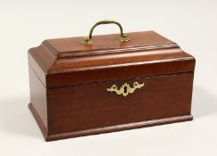 A GEORGE III MAHOGANY THREE DIVISION TEA CADDY with brass handles and escutcheon. 9ins long.