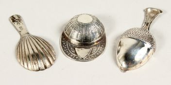 TWO SILVER CADDY SPOONS, JOCKEY CAP AND ACORN