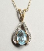 A GOLD AND AQUAMARINE PENDANT AND CHAIN