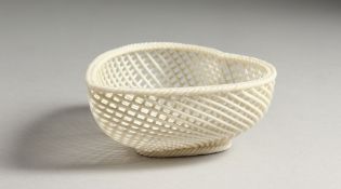 A BELLEEK PORCELAIN HEART SHAPED PIERCED BASKET 4.5ins long