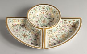 A K. P. M. PORCELAIN CIRCULAR BOWL with gilt decoration and painted with flowers. 7ins diameter