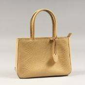 A DEBENHAMS BEIGE HANDBAG with dust cover.