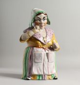 A CONTINENTAL PORCELAIN COOKIE JAR as a lady whose head and shoulders form the lid. 12ins high.
