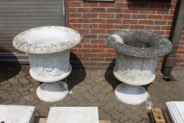 A VERY GOOD PAIR OF ITALIAN CARVED WHITE MARBLE URNS, the sides carved with figures dancing. 2ft