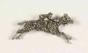 A MARCASITE JOCKEY BROOCH