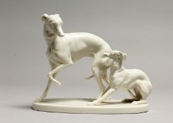 A GOOD NYMPHENBURG WHITE GLAZED PORCELAIN MODEL OF A WHIPPET AND PUP, AFTER P.J. MENE on an oval