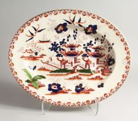 A LARGE WEDGWOOD 'CHUSAN' PATTERN, IRONSTONE TREE AND WELL CARVING DISH. 20ins wide.