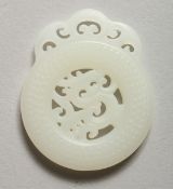 A PIERCED WHITE JADE PENDANT
