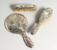 A SILVER HAND MIRROR AND 2 BRUSHES