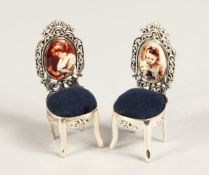 A PAIR OF NOVELTY SILVER MINIATURE CHAIR PIN CUSHIONS