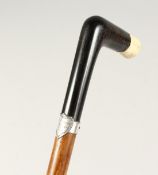 AN EBONY AND IVORY HANDLE WALKING STICK with silver band, Rick Squires 2ft 8ins long
