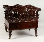 A 19TH CENTURY ROSEWOOD THREE-DIVISION CANTERBURY, with turned end, a single drawer, on turned