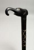 AN INLAID EBONY WALKING STICK, the handle as an elephant’s head 35ins long