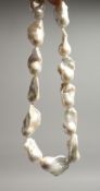 A LARGE BAROQUE PEARL NECKLACE with silver magnetic clasp 46cm
