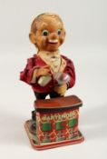 A TIN PLATE TOY BARTENDER 12ins high.
