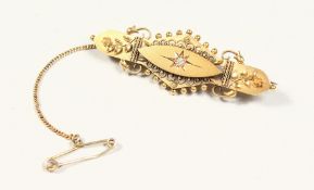 A VICTORIAN 15CT GOLD AND DIAMOND BROOCH