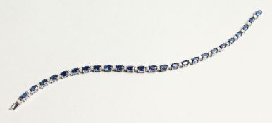 AN 18CT WHITE GOLD AND SAPPHIRE AND DIAMOND LINE BRACELET 17cm long