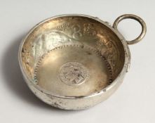 A 19TH CENTURY FRENCH SILVER WINE TASTER inset with an 1872 one Franc coin.