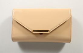 AN L. K. BENNETT BEIGE PATENT LEATHER CLUTCH BAG with dust cover, as new.