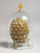 A REPLICA RUSSIAN FABERGE EGG on stand, with a dome.