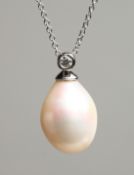 AN 18CT WHITE GOLD AND FRESHWATER PEARL PENDANT with fine chain. Pearl 13mm, chain 43cm long,