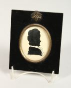 A LATE 9TH CENTURY SILHOUETTE PORTRAIT OF A LADY, framed oval, in an ebony frame. 5ins x 4.25ins.