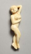A CARVED BONE NUDE FEMALE FIGURE 3.5ins long