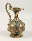 A SUPERB HUNGARIAN SILVER GILT CLARET JUG, mounted with pearl and other stones. 9ins high