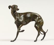 A SMALL BRONZE WHIPPET, POSSIBLY BY MENE, standing, holding up its front legs 5ins long