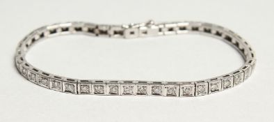 AN 18CT WHITE GOLD AND DIAMOND LINE BRACELET, diamond approx. 2ct. 18cm long