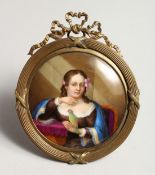A GOOD CONTINENTAL CIRCULAR PORCELAIN PLAQUE, a girl with a parrot 3ins diameter in a gilt frame